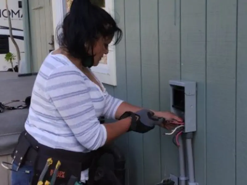 Licensed electrician wiring an exterior subpanel in Lake Tansi